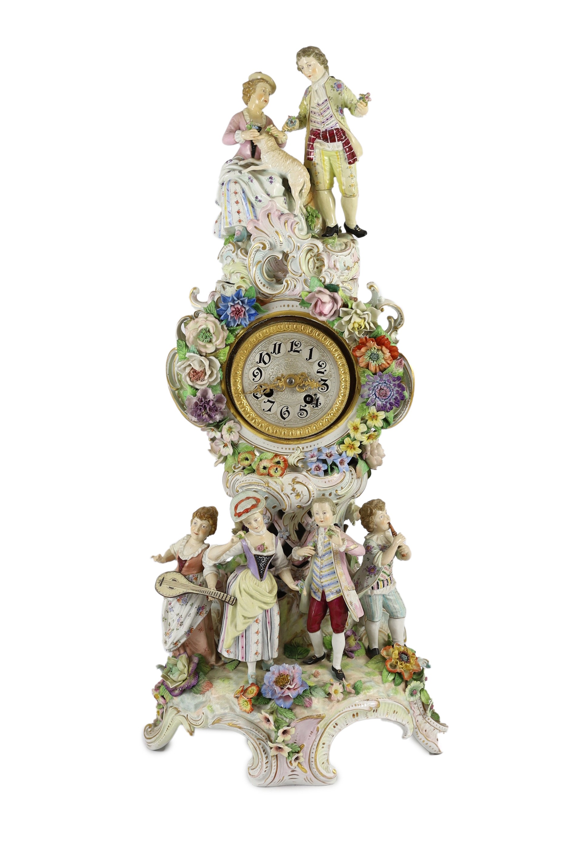 An impressive German porcelain floral encrusted figural mantel clock, late 19th century, Total height 65 cm